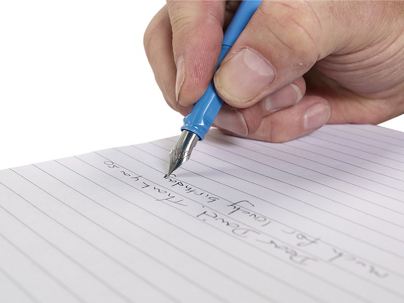 Hand writing with a blue pen on lined paper
