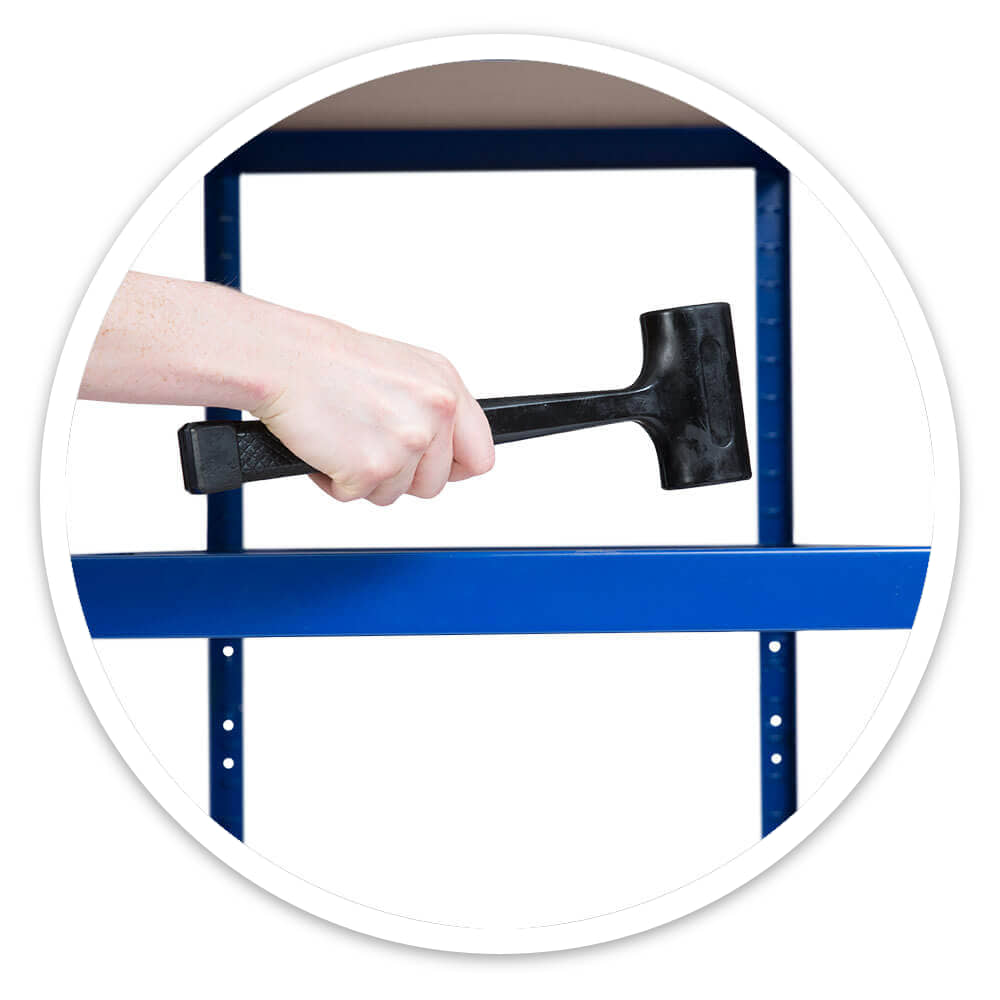 Hand tapping an archive box shelving beam into place with a rubber mallet