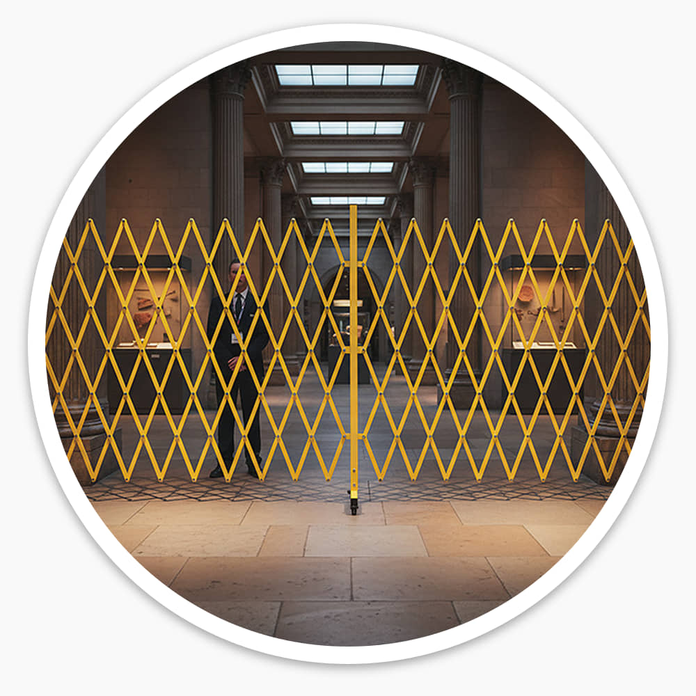 Yellow Extra Large Expandable Barrier stretched across a colonnaded hall to close it off