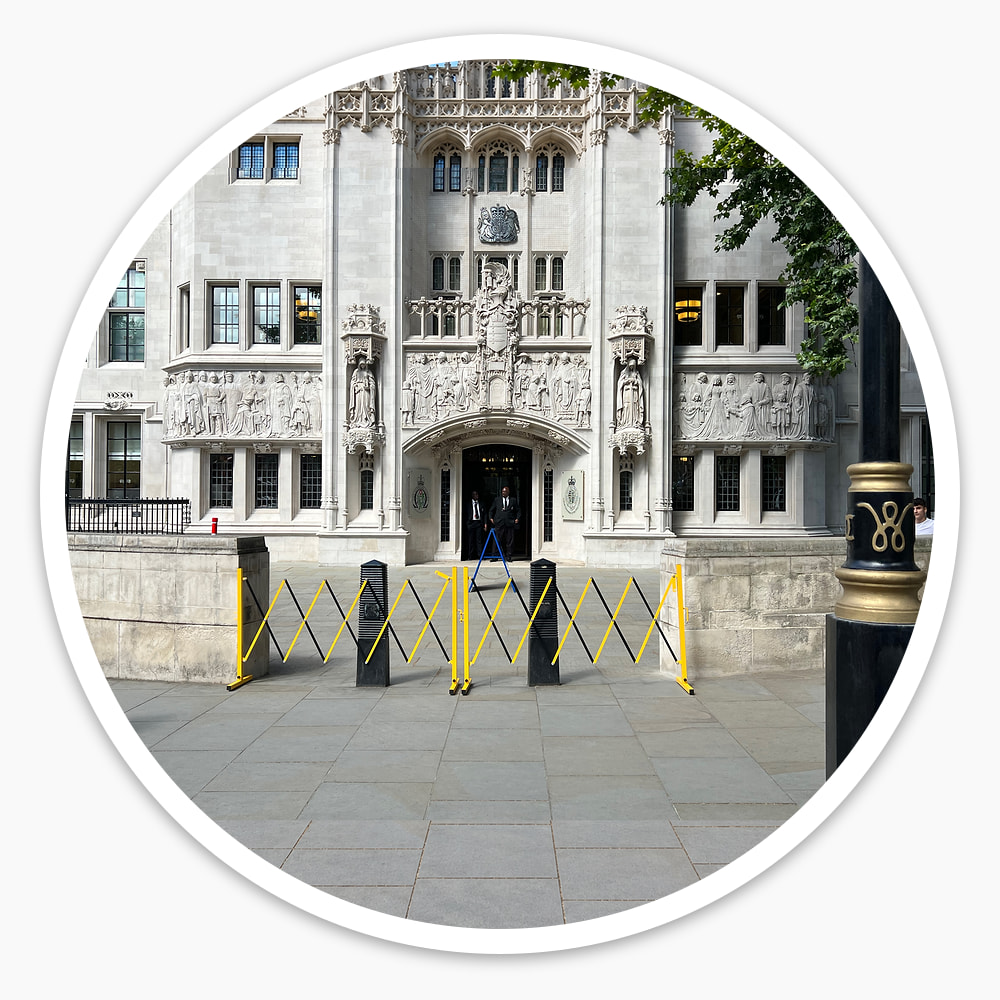 Yellow and black Small Expanding Safety Barriers marking off a public building's entrance from the pavement