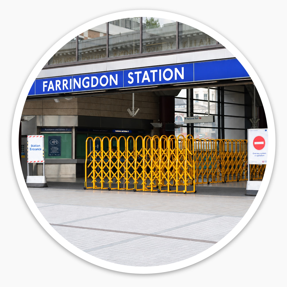 Yellow Large Expandable Safety Gates opened across the entrance to Farringdon Station