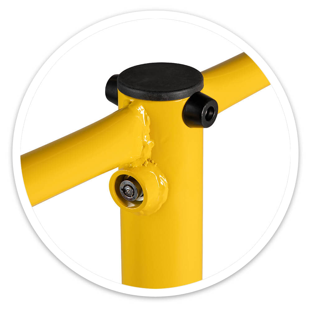 Close-up of the yellow mild steel folding parking barrier's welded post top, with black rubber cap, bumpers and lock