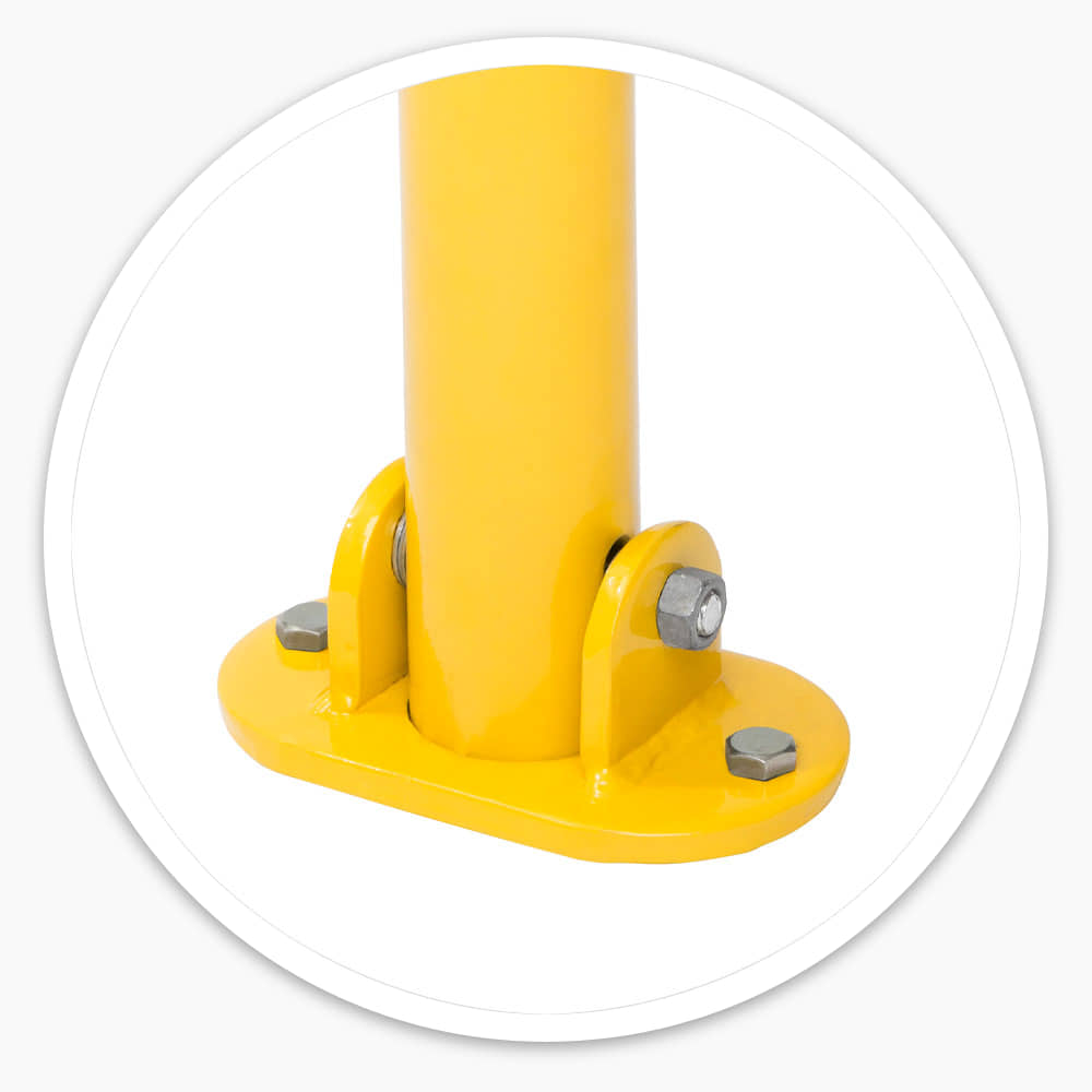 Close-up of the yellow folding parking post's bright powder-coated steel base plate, hinge brackets and bolts