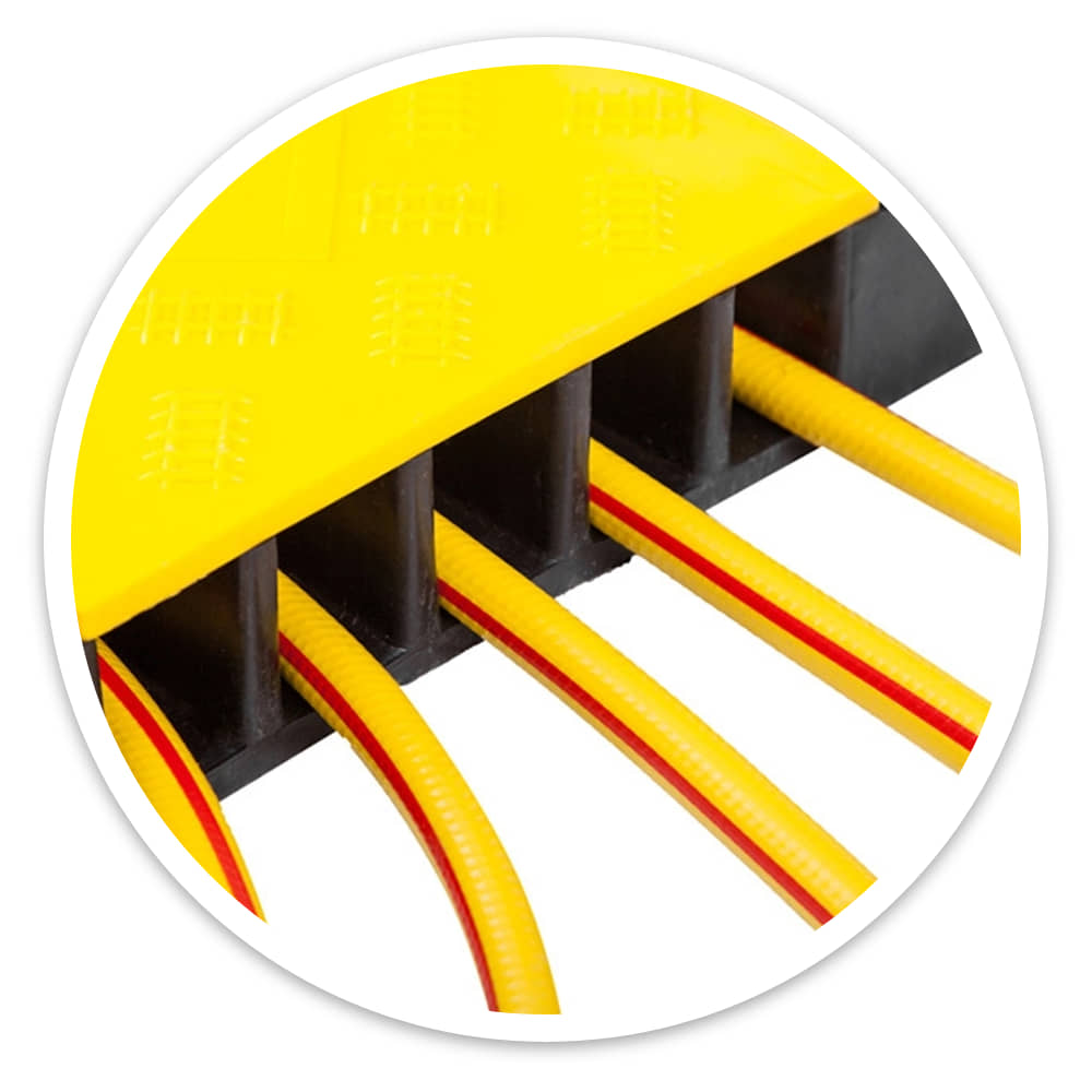 Close-up of the yellow hinged lid over cables in the channels of a 5 channel cable ramp