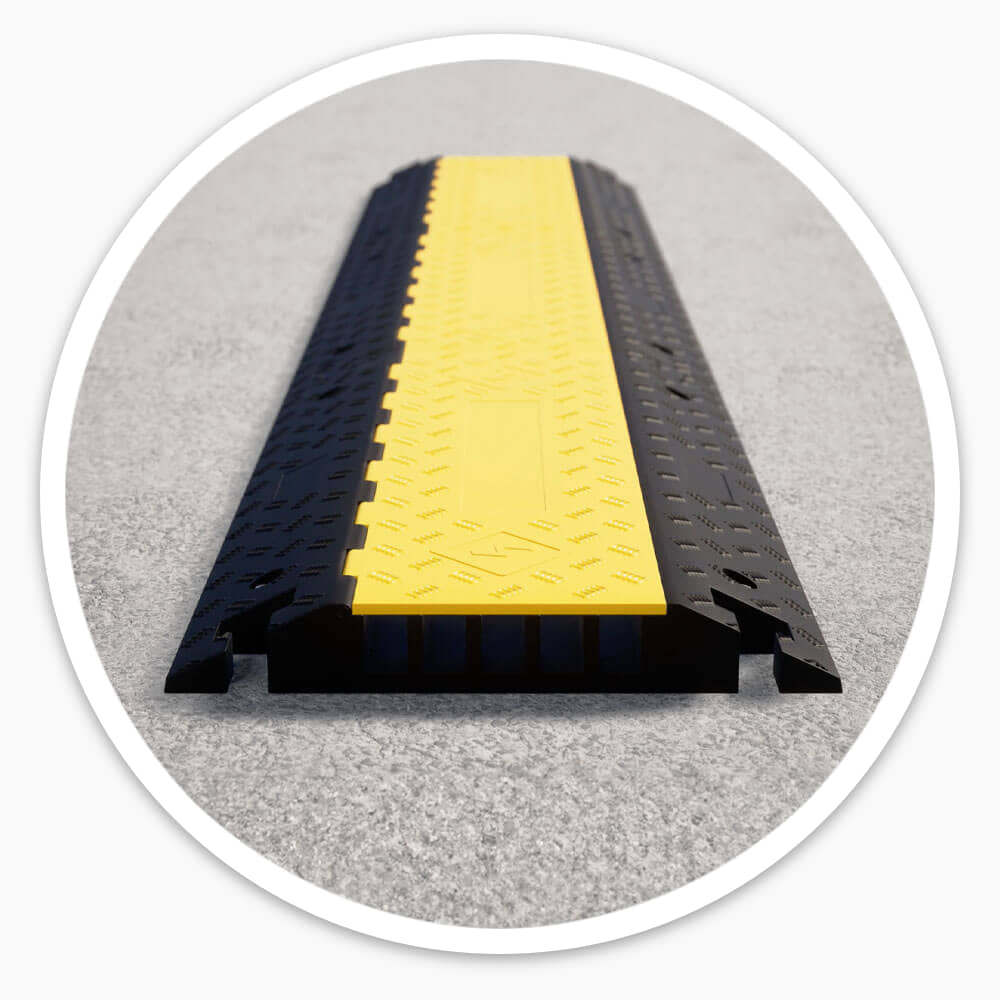 5 channel cable ramp on a concrete floor showing its sloped black sides and yellow lid