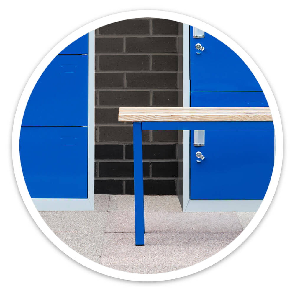 1500mm cloakroom bench with open steel frame standing between blue lockers