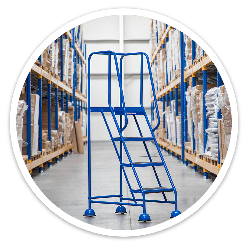 4 Tread Mobile Safety Steps standing on their cupped feet in a warehouse racking aisle