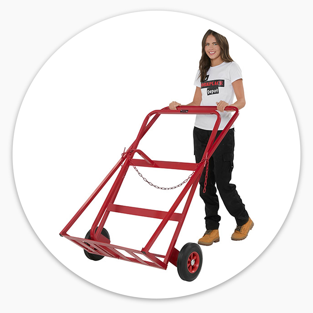 Woman gripping both handles to push the empty red Double Gas Cylinder Trolley