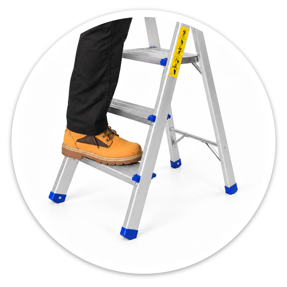 Work boot planted on the wide anti-slip bottom tread of the 3 tread lightweight aluminium step ladder