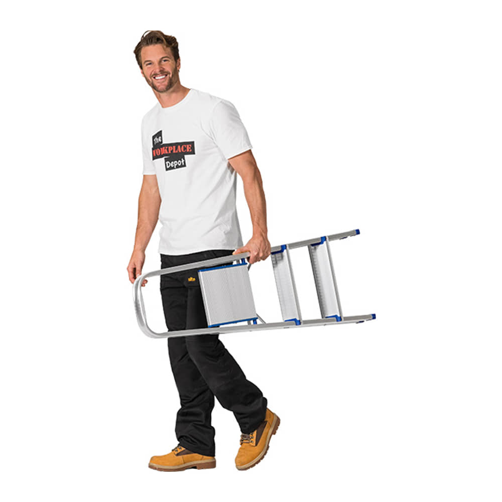 Man carrying the folded 3 Tread Lightweight Aluminium Step Ladder one-handed, showing its slim 110mm folded depth
