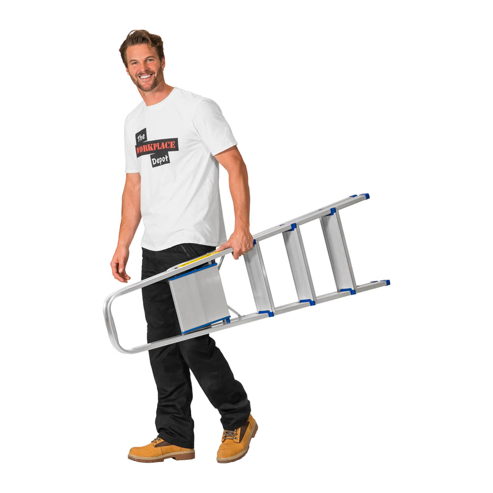 Man carrying the folded 4 Tread Lightweight Aluminium Step Ladder, showing its slim fold-flat profile