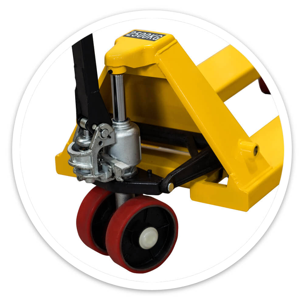 Close-up of the hydraulic pump unit and polyurethane steer wheels on the yellow pallet jack