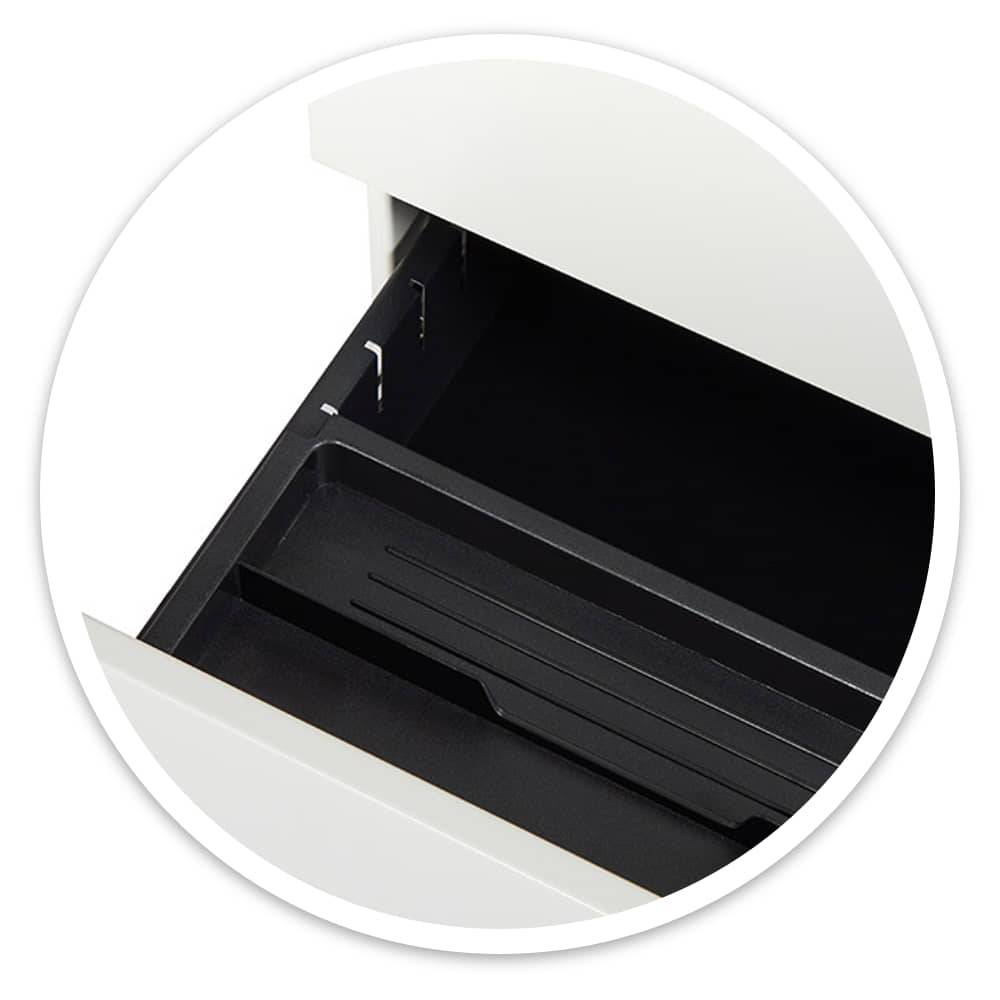 Open top drawer of the white mobile pedestal showing the black pen tray and side runner
