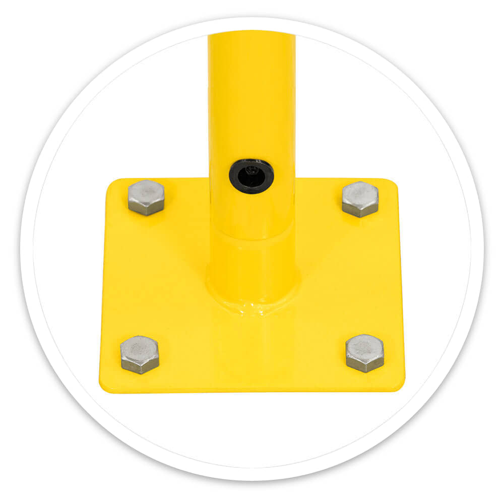 Close-up of the safety railing's 150mm square yellow base plate bolted down with four bolts