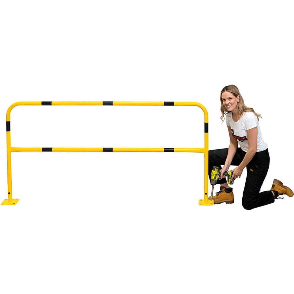 Woman kneeling to fit the safety railing, with its lower rail level with her legs