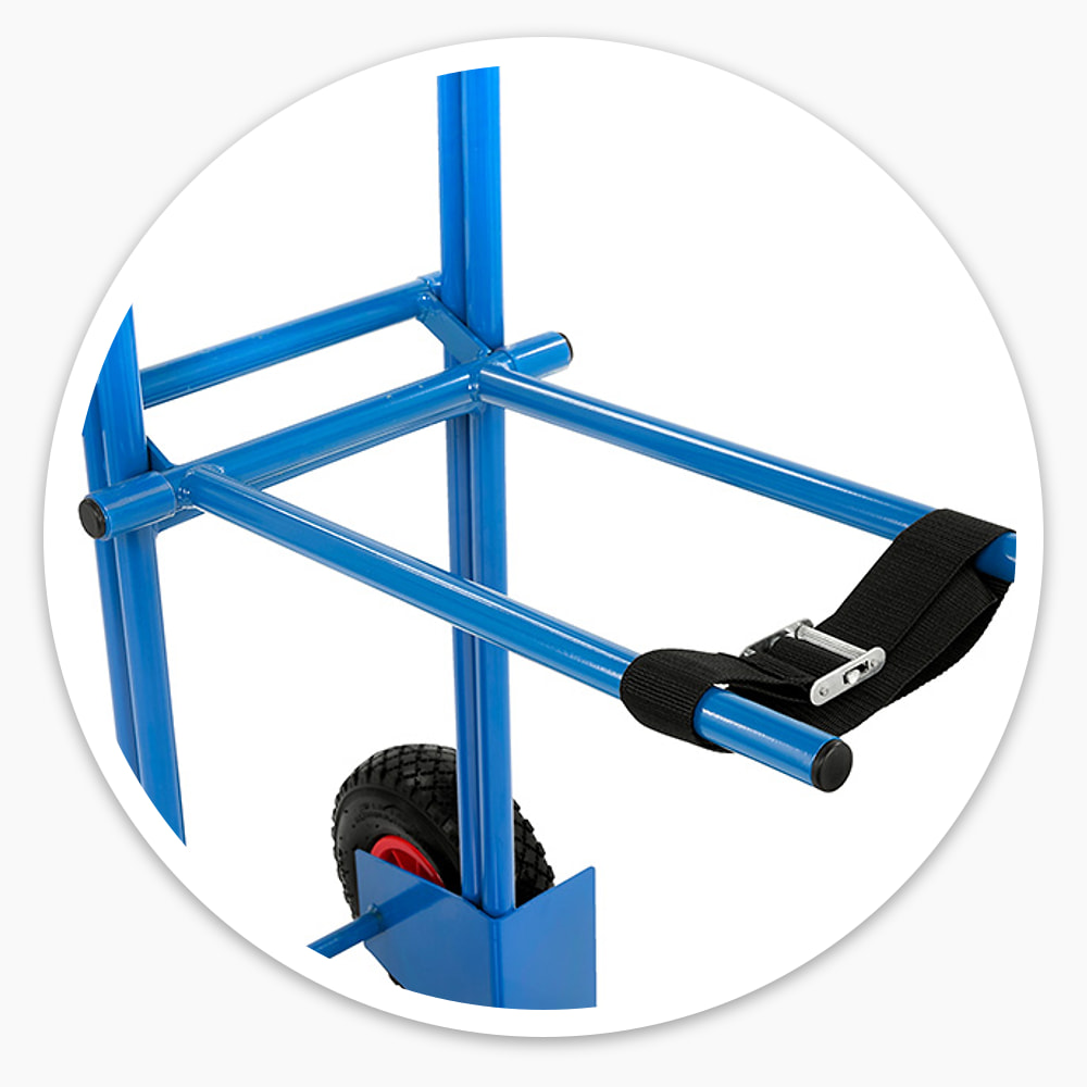 Chair moving trolley's blue steel fork arms with a black ratchet strap, above puncture-proof wheels and the toe plate
