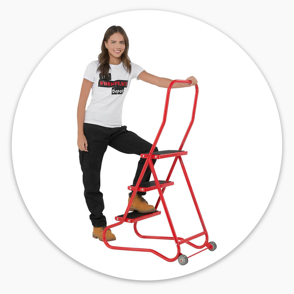 Woman holding the full-width grab handle of the 3 Tread Wheelalong Mobile Steps as she steps up
