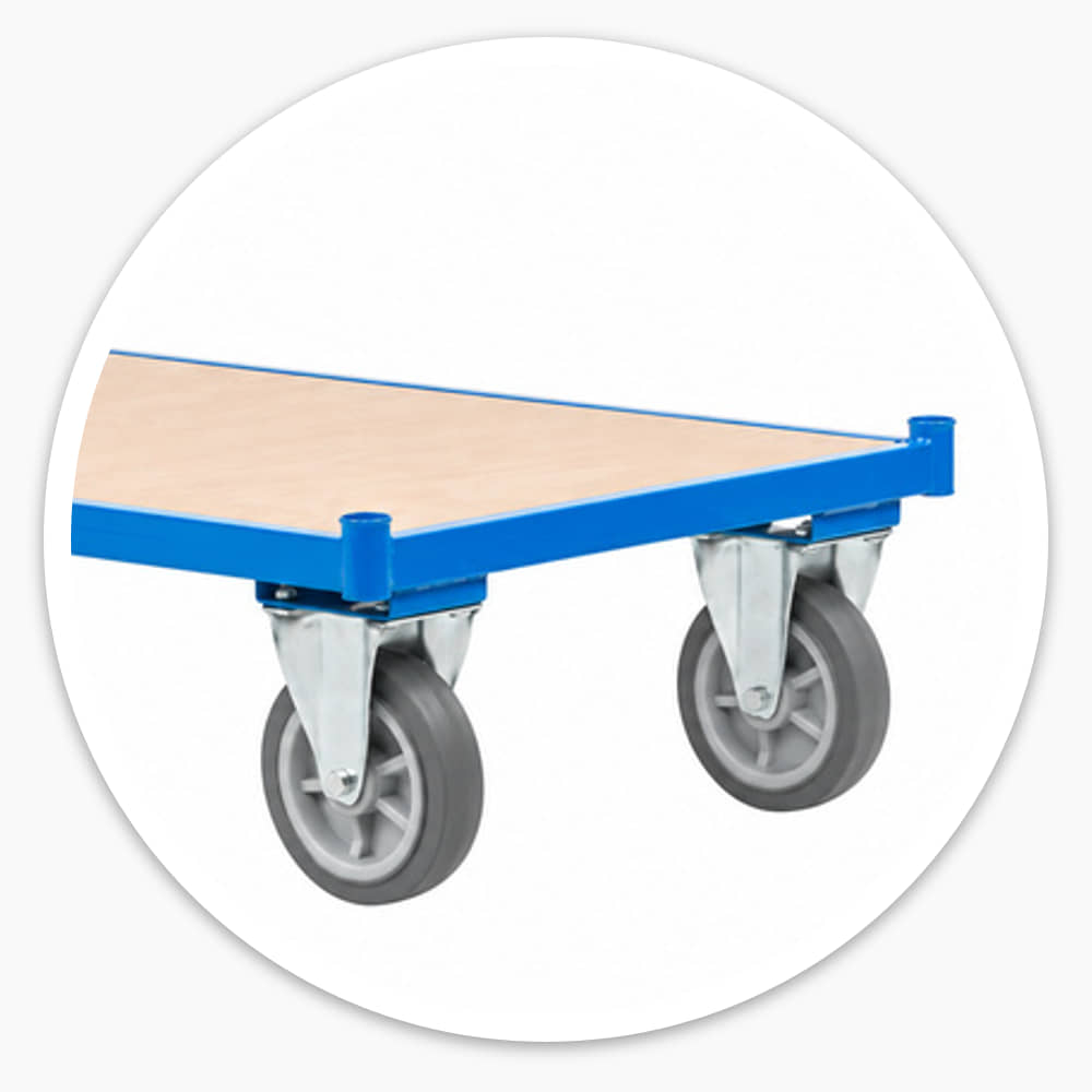 Flatbed trolley with push handle, blue steel frame, plywood deck and back panel on four grey castor wheels
