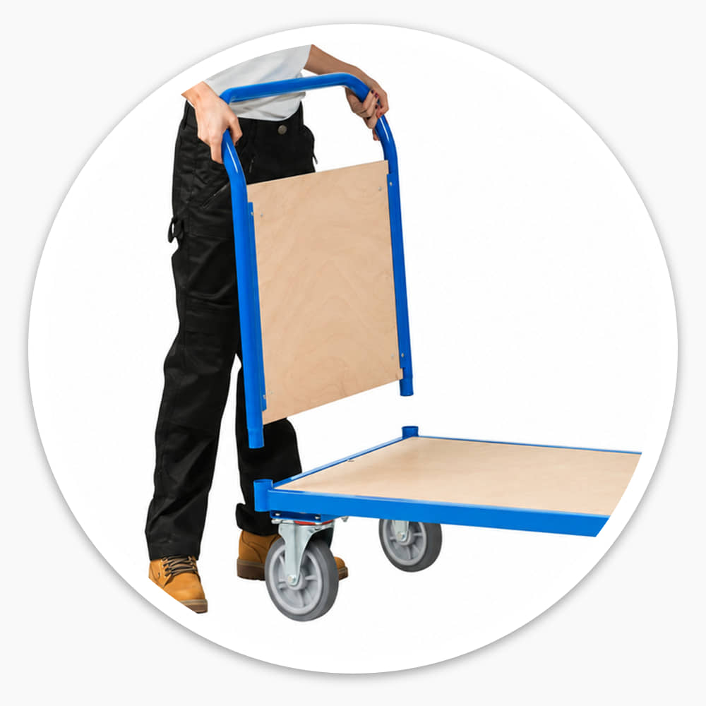 Woman lifting a blue double-handle platform cart's plywood-panelled handle, its steel frame and swivel castors on white