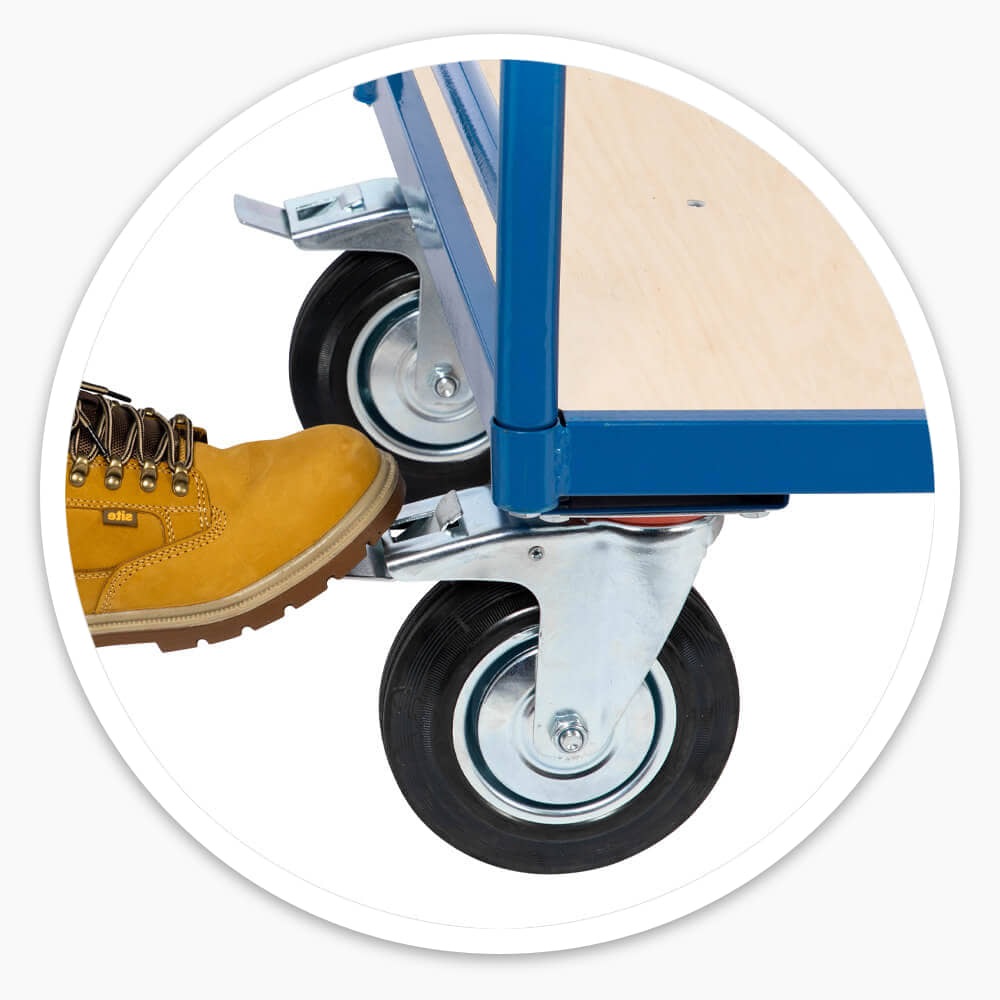 Work boot pressing the foot-operated brake on a Platform Truck swivel castor