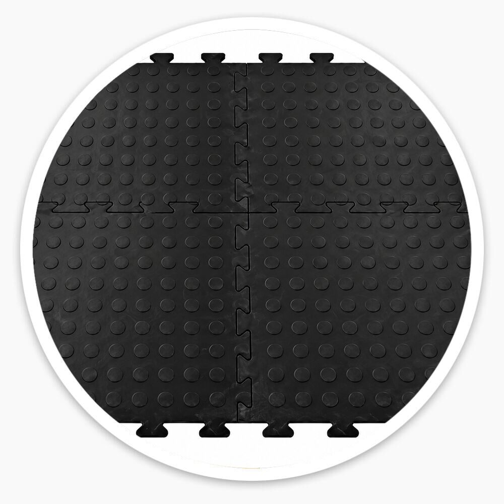 Black interlocking vinyl floor tiles with raised dotted surface