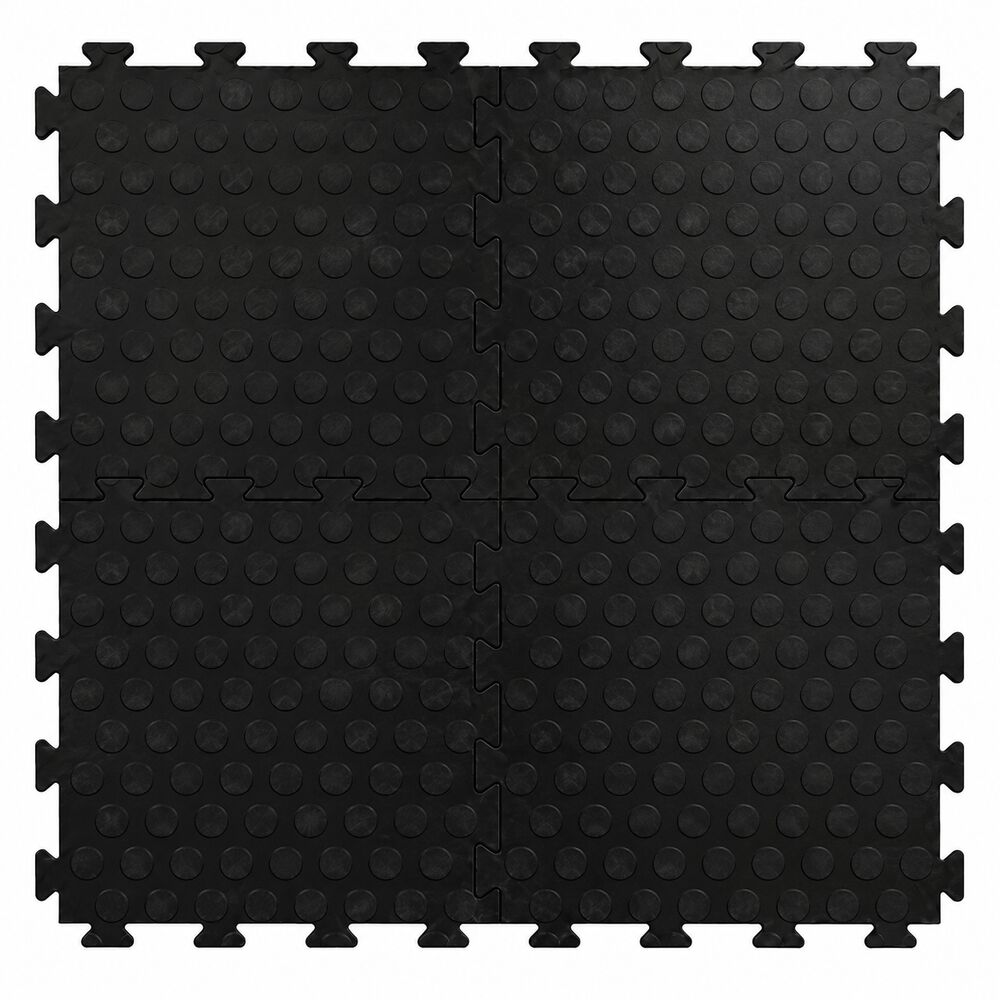 Black interlocking vinyl floor tiles with raised dotted surface