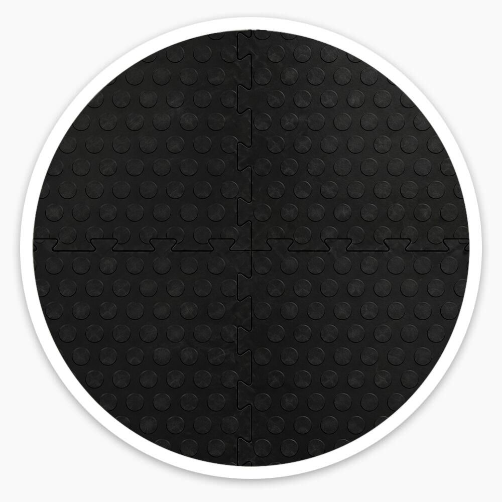 Black interlocking vinyl floor tiles with raised dotted surface